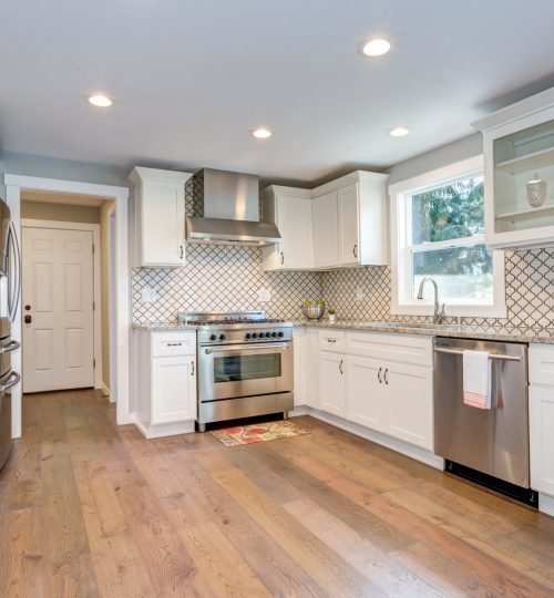 Gorgeous white kitchen room with Moroccan Tiles Backsplash.